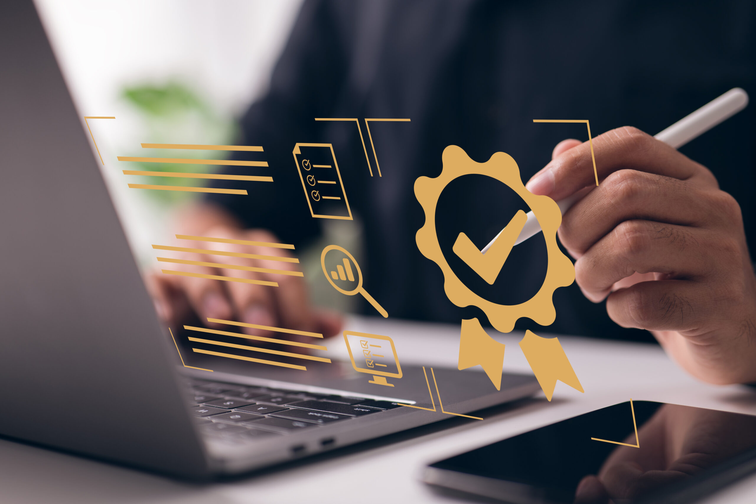 stock image of a person working at a laptop. a check mark badge floats parallel to the screen.